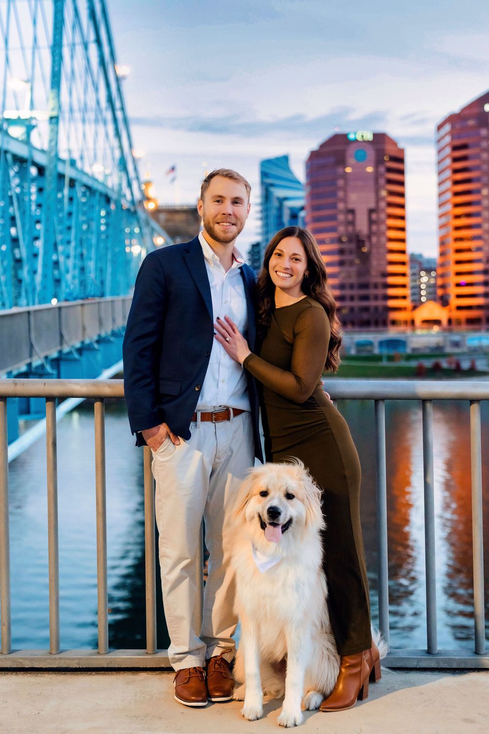 Liz and Chris's Engagement Downtown Cincinnati at Smale Park with standing with their puppy: Cincinnati Wedding Photographer