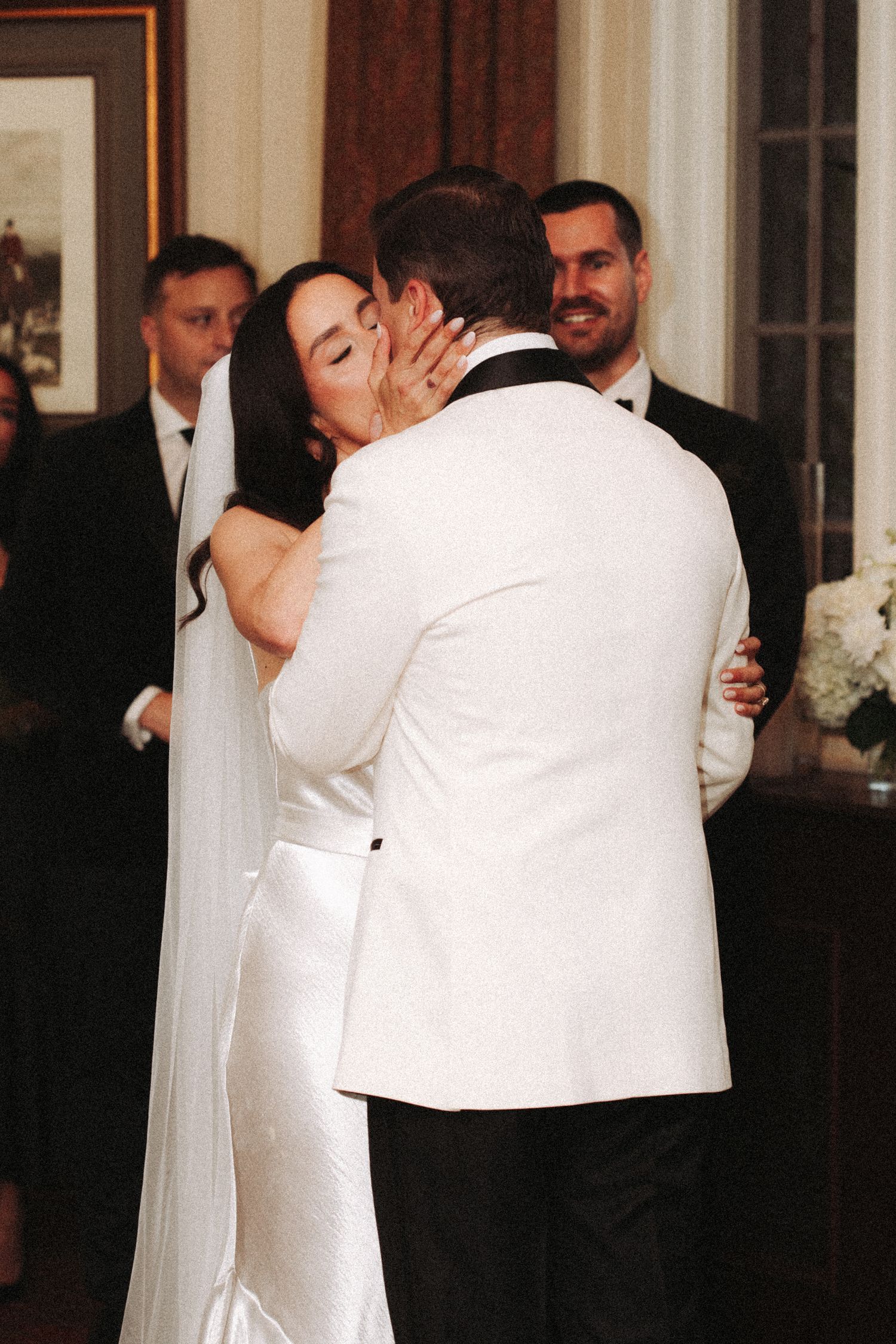 A series of photos showing a bride and groom dancing together at their wedding reception in formal attire.
