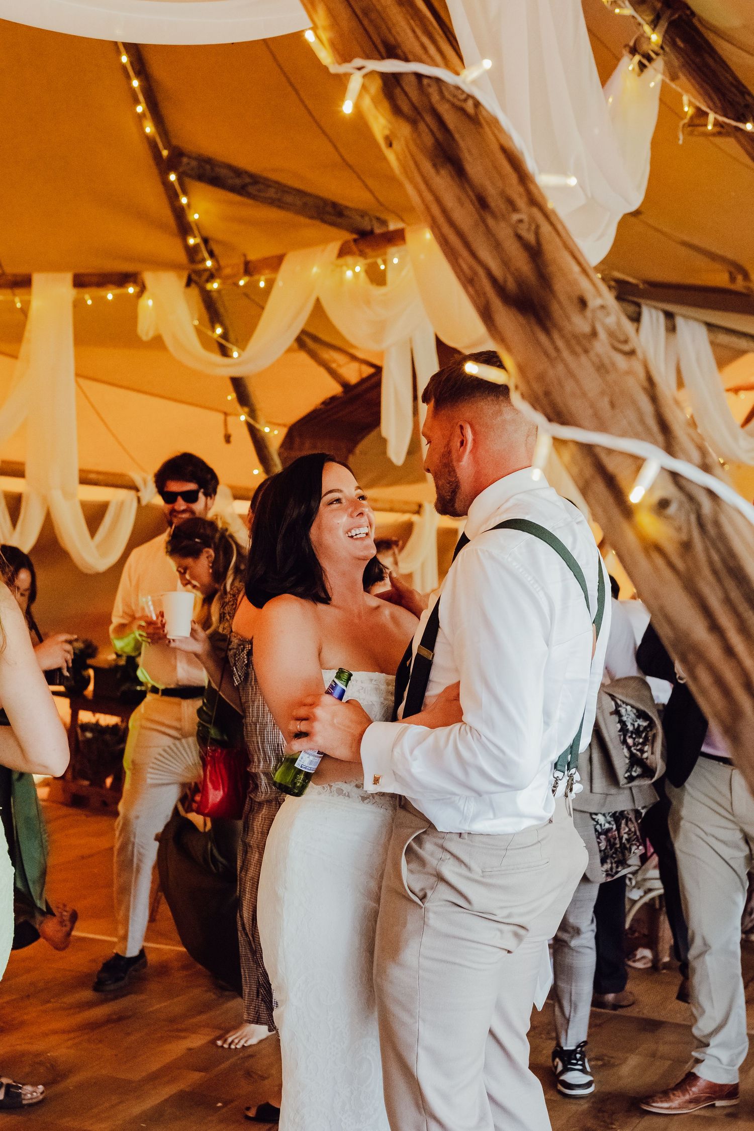 A couple enjoying a lively moment on the dance floor at their wedding.