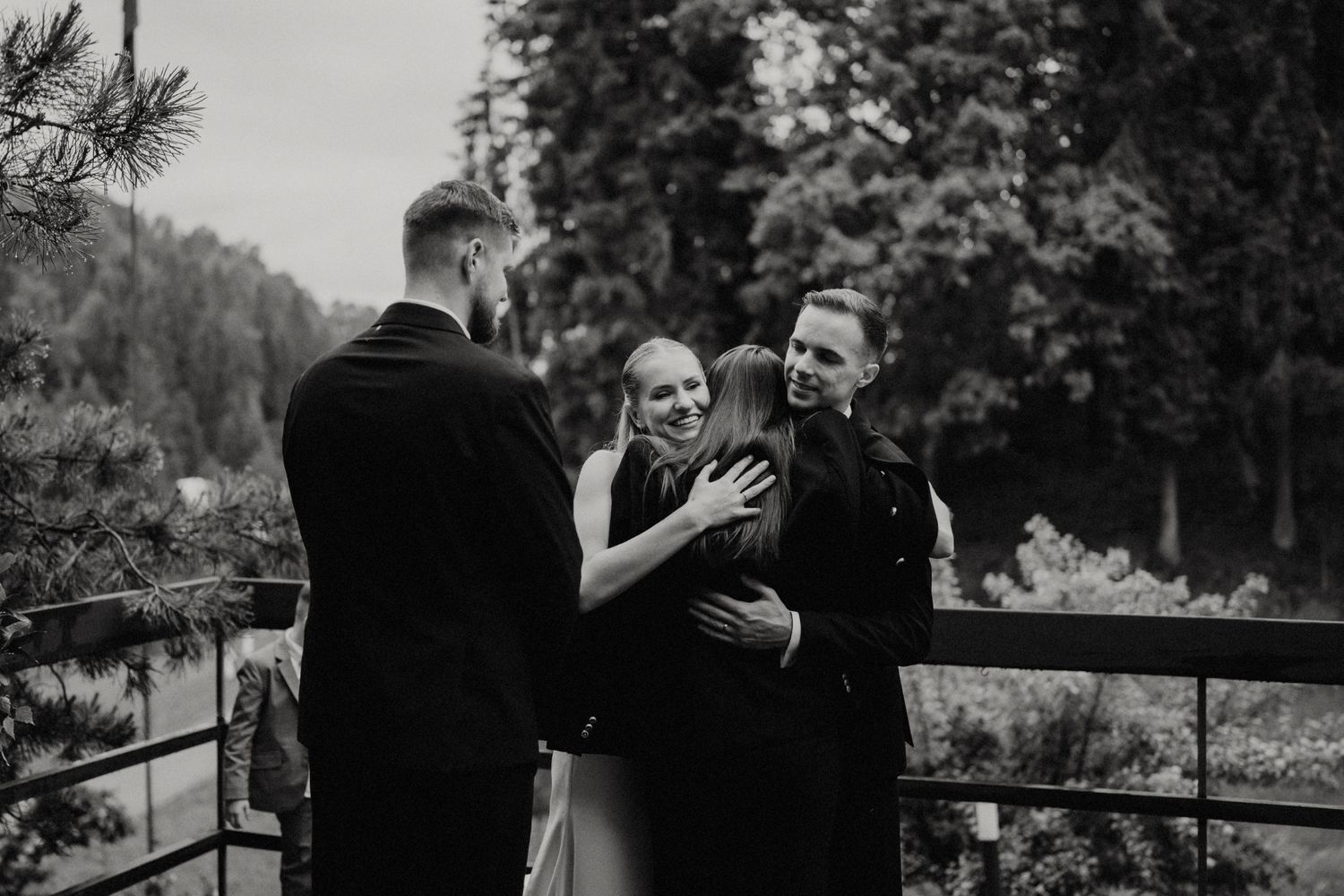 Black and white photographs capturing emotional moments during an outdoor celebration.