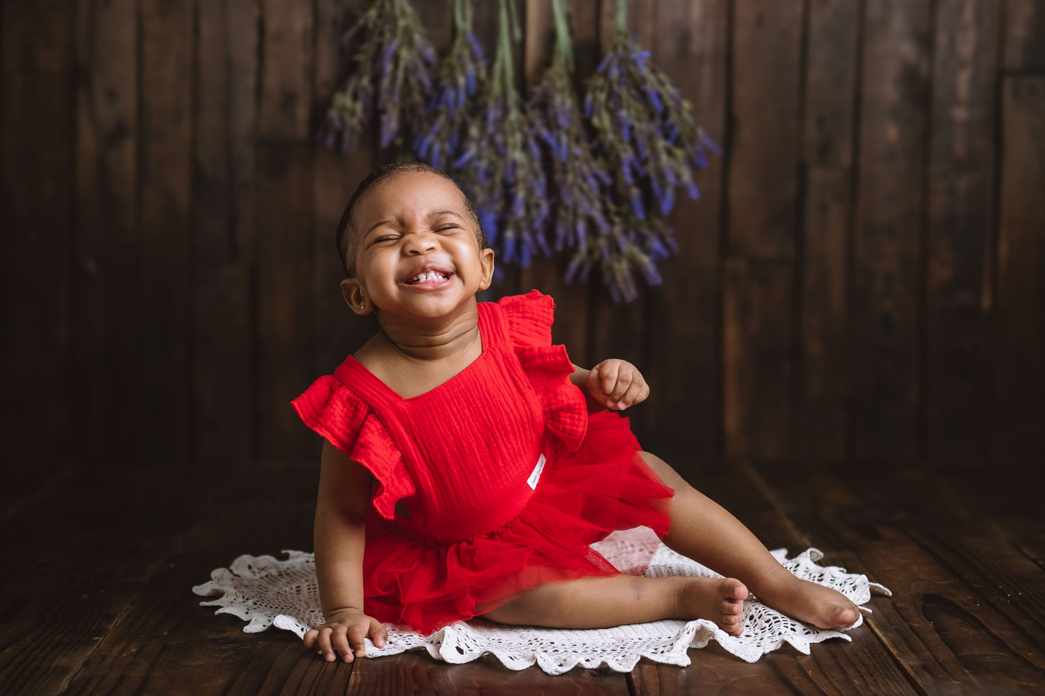 Six-month-old baby girl photographed in studio with gentle lighting
