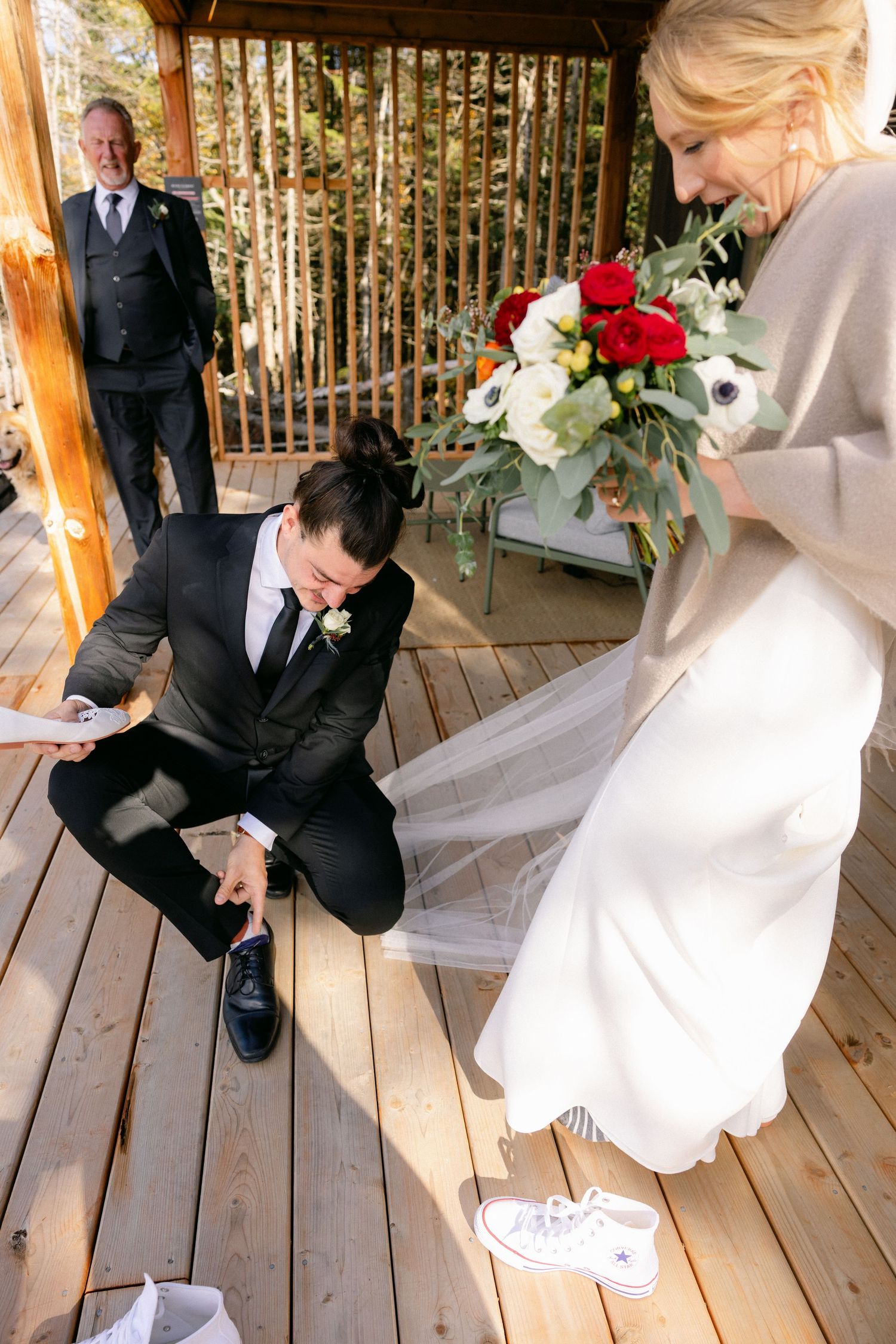 A sequence of romantic wedding photos showing a couple sharing playful moments on a wooden deck with floral decorations.