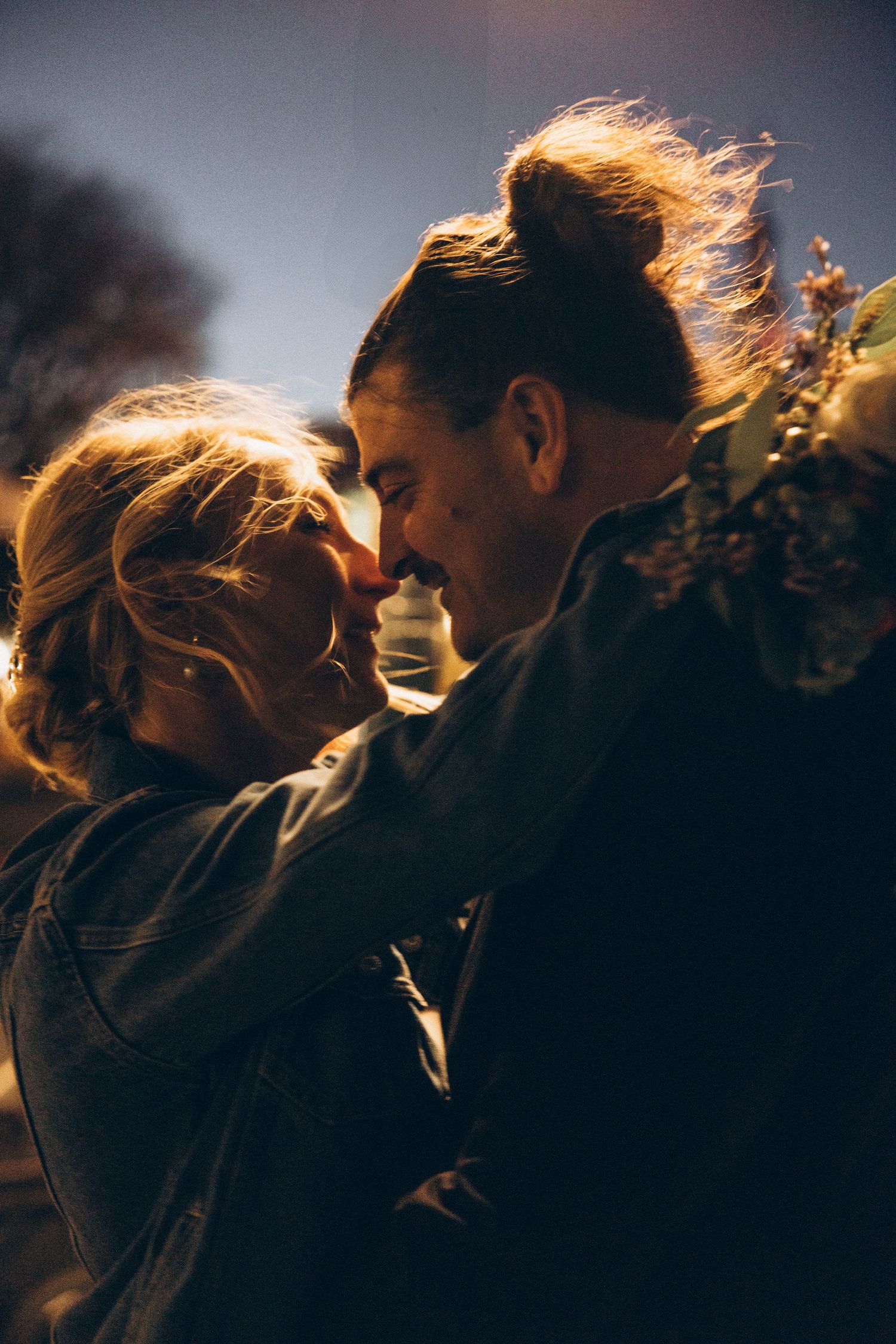 Silhouetted couple embraces in dramatic backlit scenes showing intimate romantic moments.