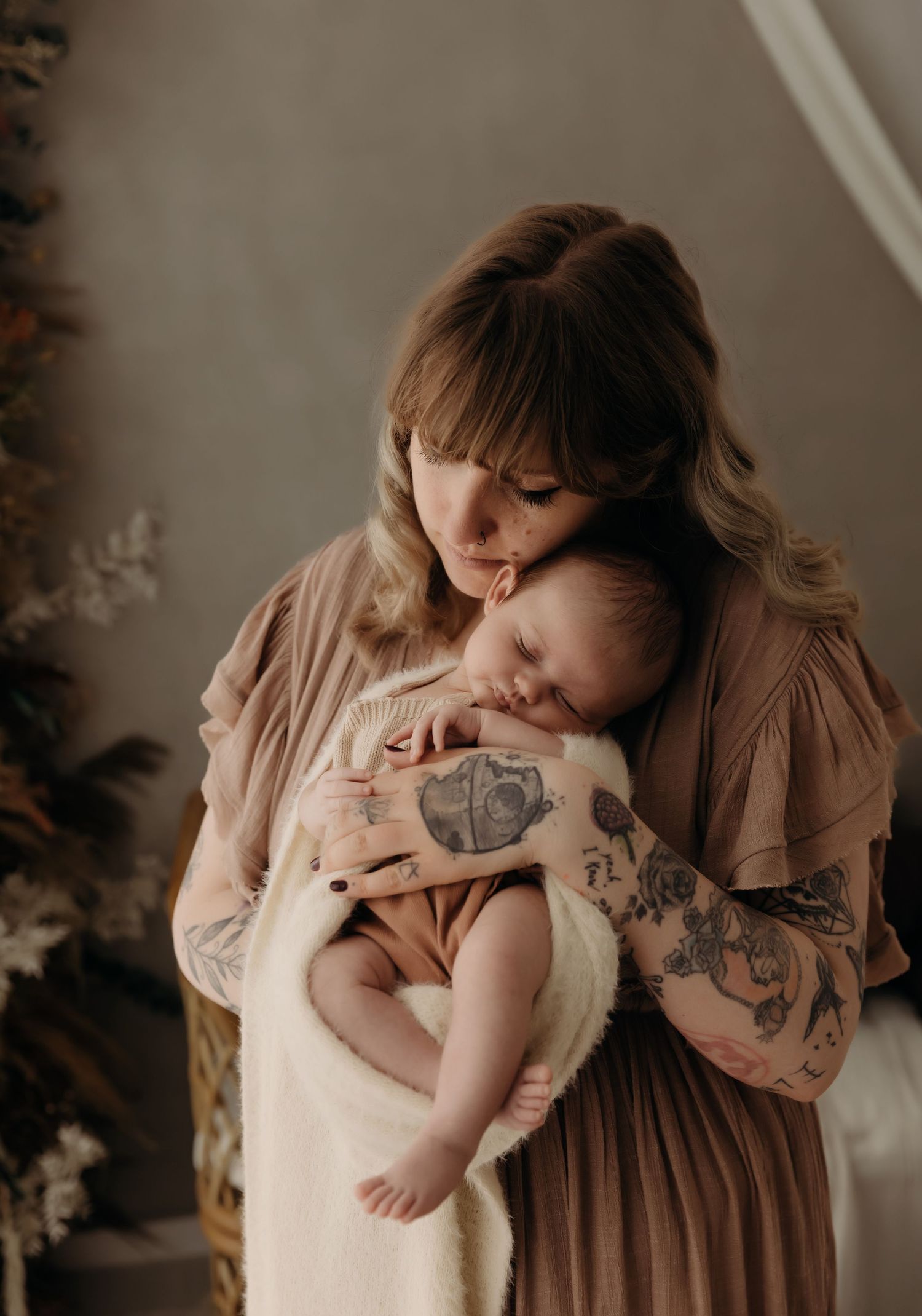 mullingar newborn photographer. LM Family photography. Mother cuddling baby in newborn photoshoot in Mullingar Westmeath