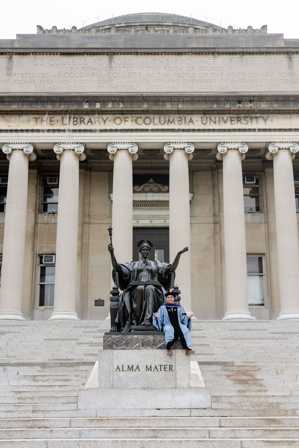 Columbia University Library facade with Alma Mater statue and iconic columns on a bright day.