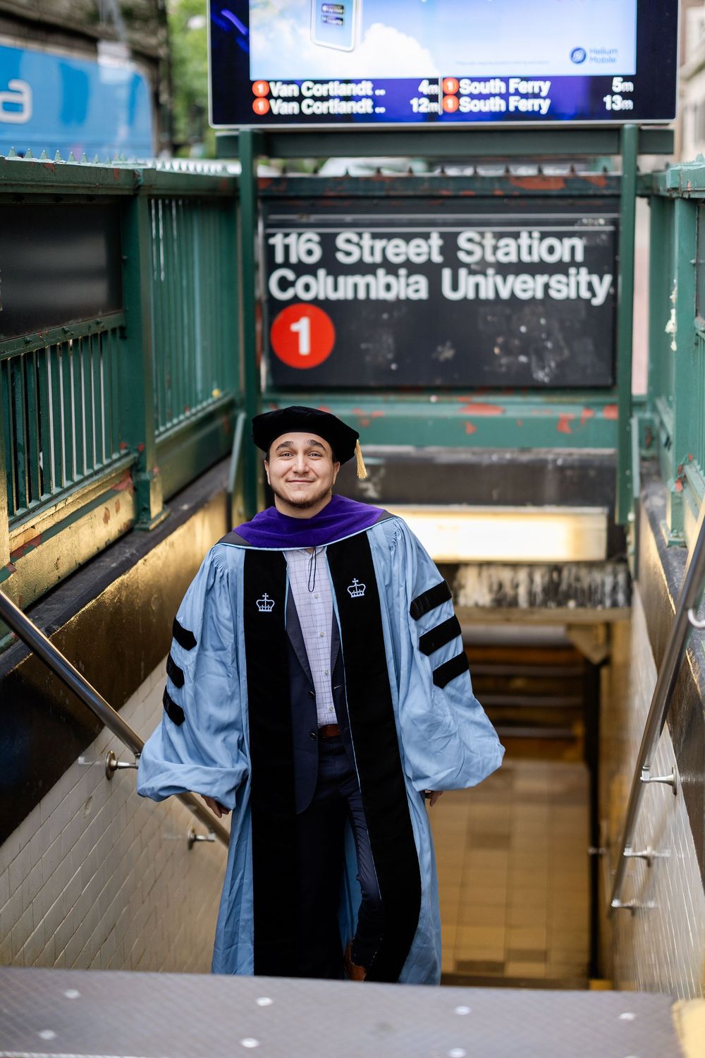 Academic graduate poses at various NYC subway stations including Columbia University stop.