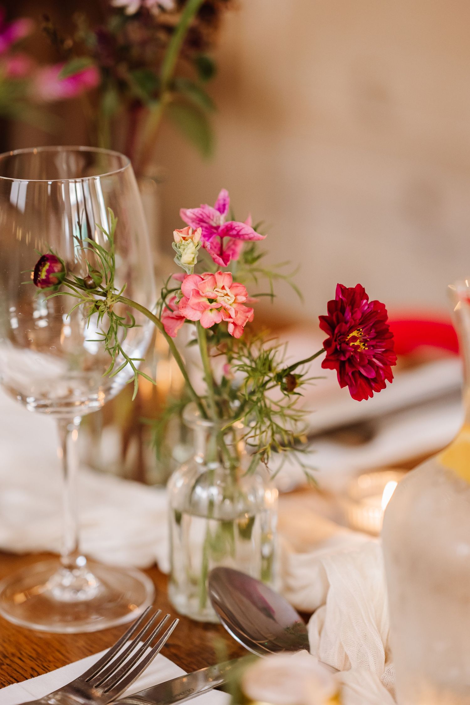 Wildflowers in bud vases at The West Gate Winchester. Wedding Venue. Hampshire candid wedding photographer