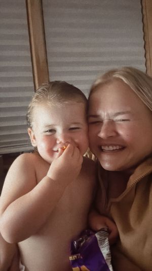 A heartwarming sequence of candid moments showing a parent and child sharing laughter and playful expressions together.