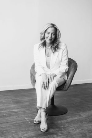 Monochrome photo sequence featuring someone in white attire seated in various relaxed positions.