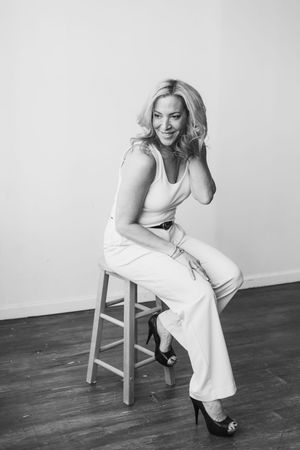 Black and white photo series showing casual poses on a wooden chair against a minimalist background.