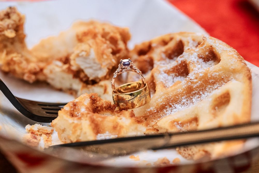 Close-up of golden brown pastries arranged on a red surface.