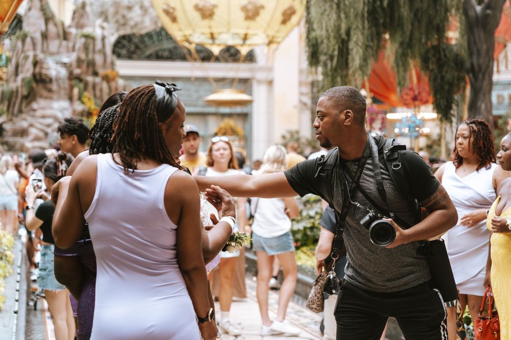 A group of people dance together during an outdoor summer event in a public space.