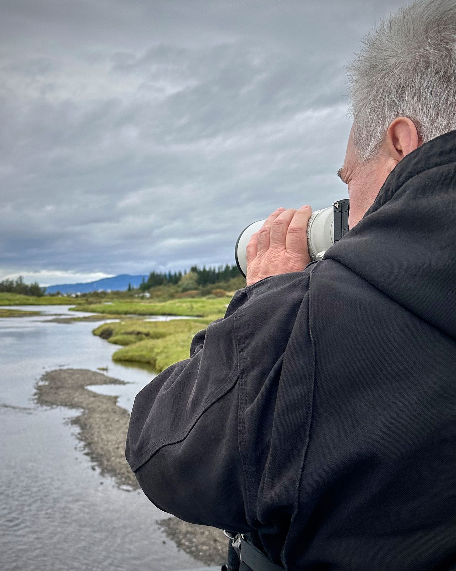 Photographer capturing a landscape scene