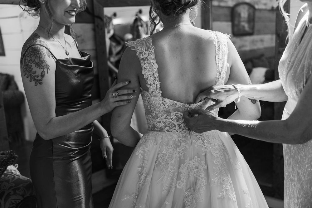 A black and white photo collage shows wedding reception guests dancing and celebrating at a formal event.