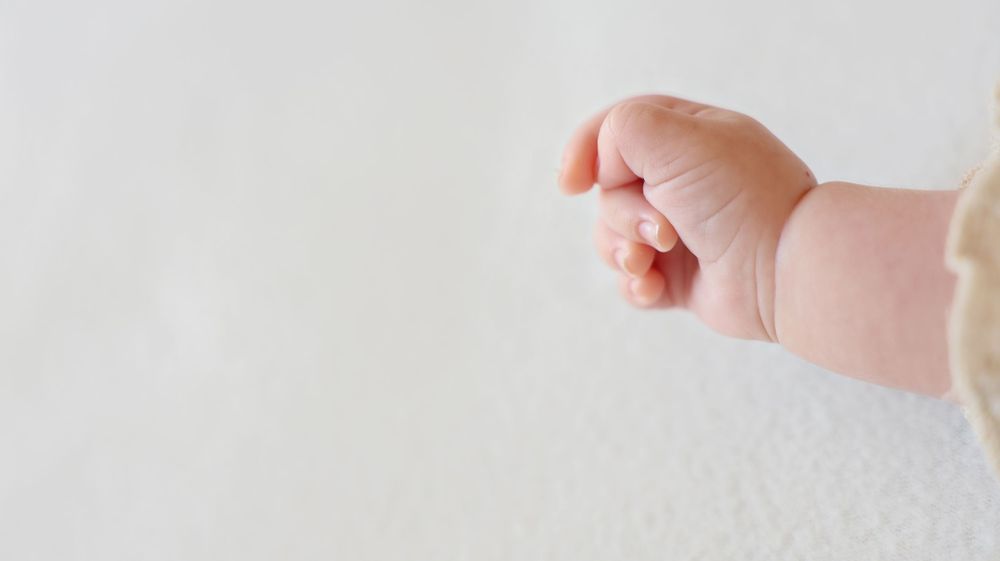 details of baby's hand up close. micro photography
