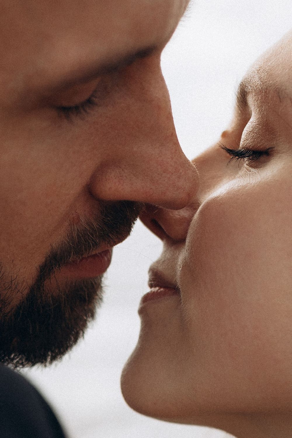 Close-up sequence showing an intimate moment between a bearded person and their partner.