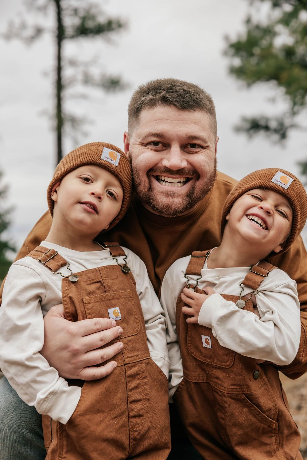 Joyful family portrait sequence showing natural laughter and connection outdoors.