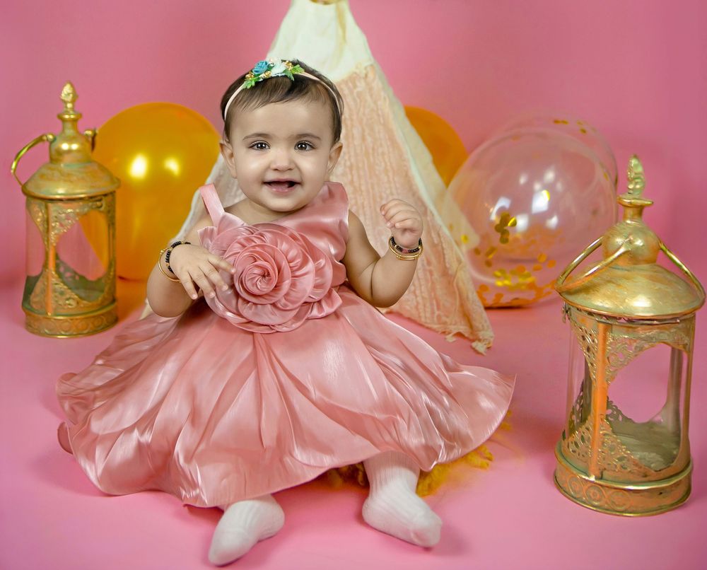 Frisco TX cake smash photography by Bhaire Photography, baby enjoying first birthday messy cake session.
