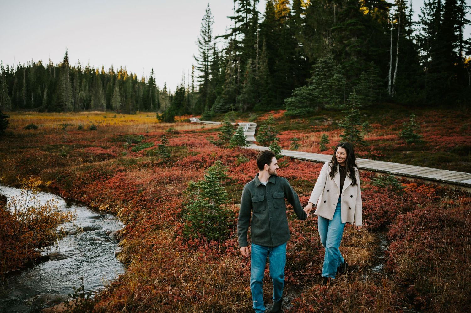 What to wear for your Vancouver Island photoshoot? This couple wore jeans and a grey and beige jacket in the fall on Mount Washington
