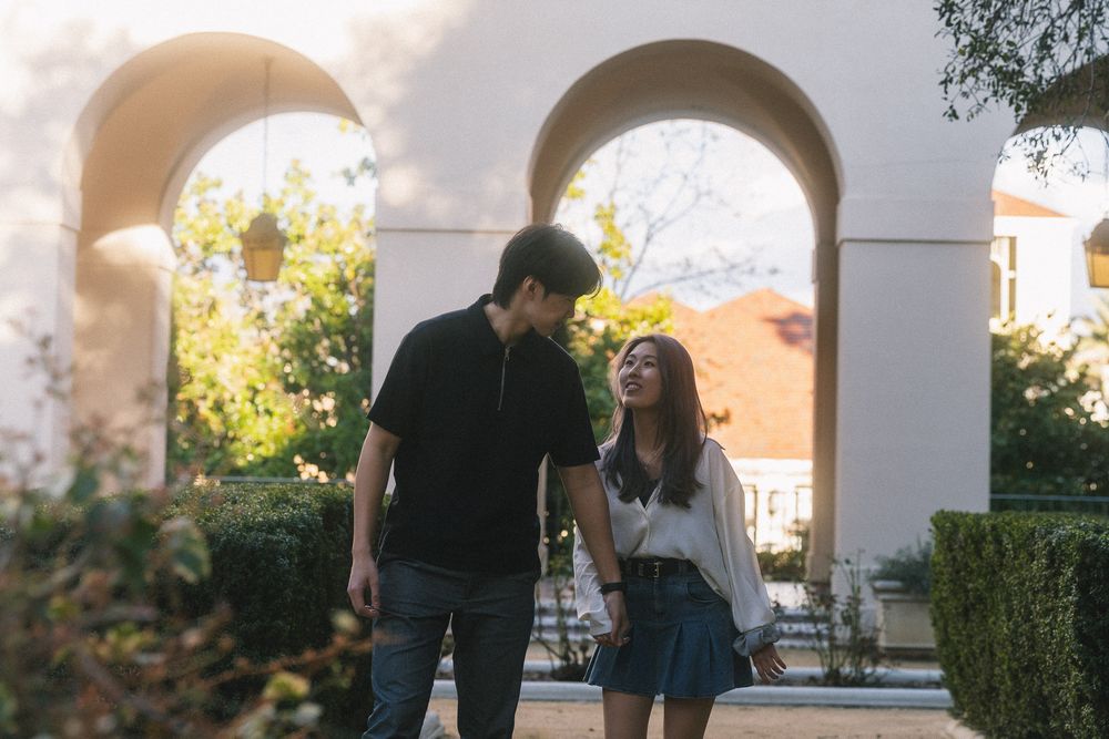 Close-up of couple smiling at each other with soft backlight at Pasadena City Hall Los Angeles