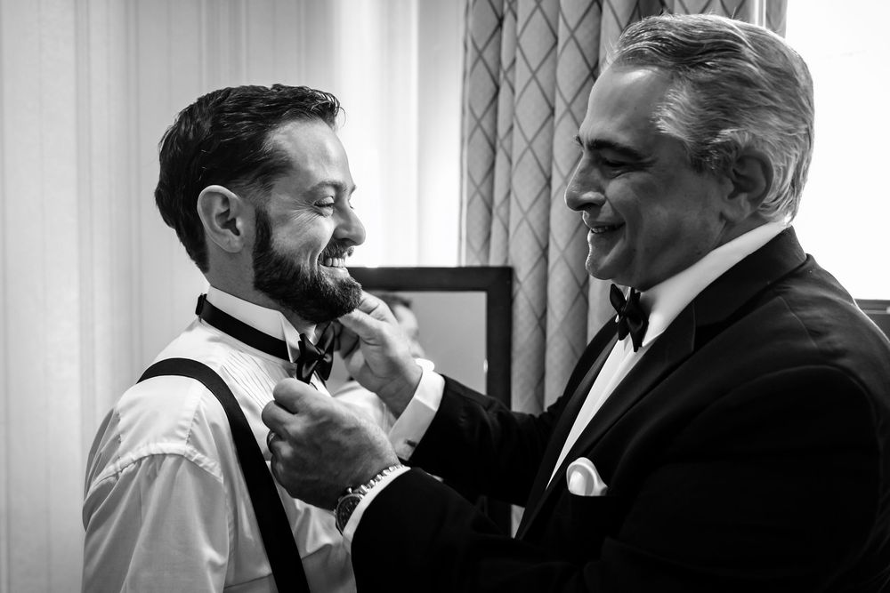 Black and white candid moments between wedding party members.