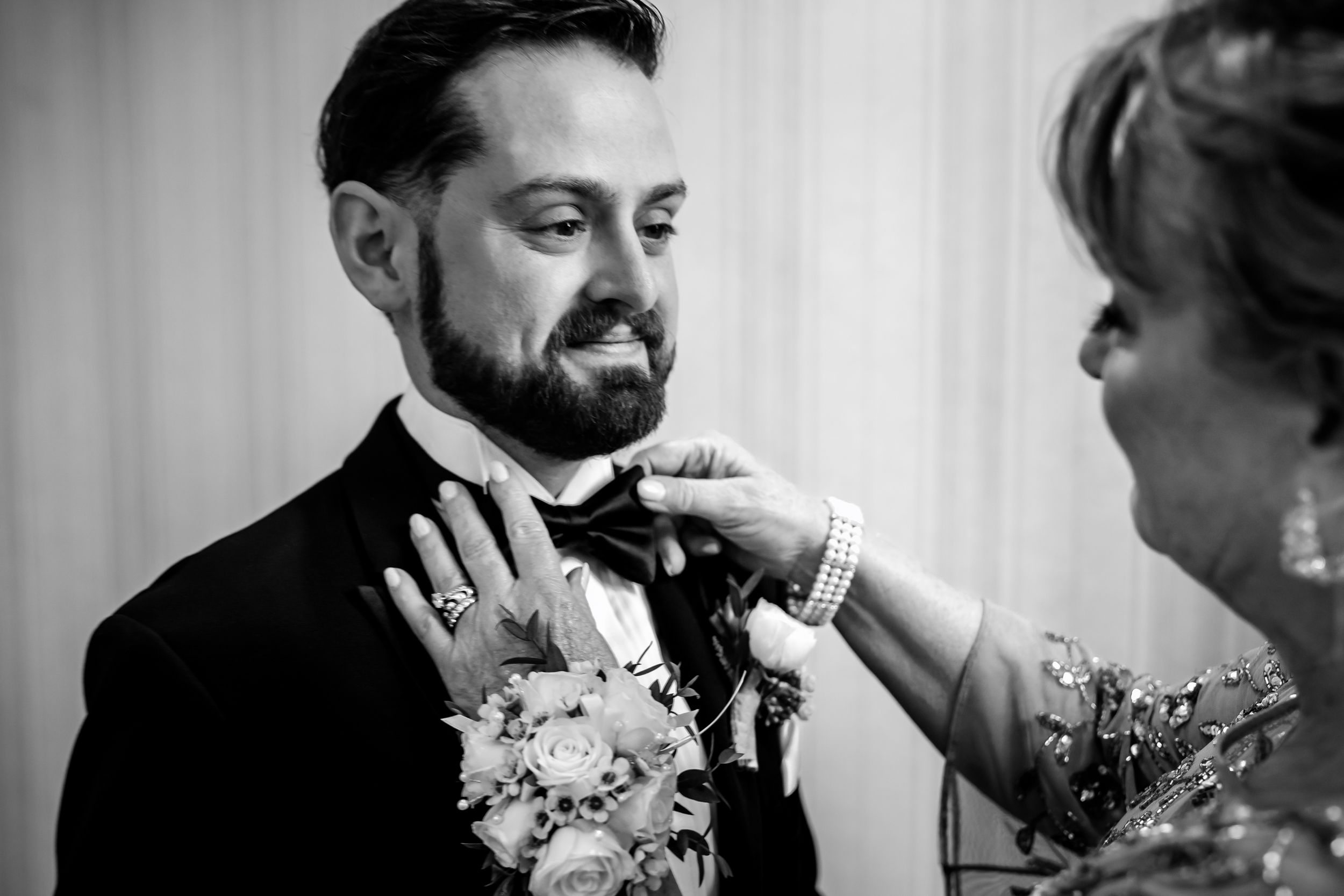 Candid moments of celebration with floral boutonnieres and formal attire.