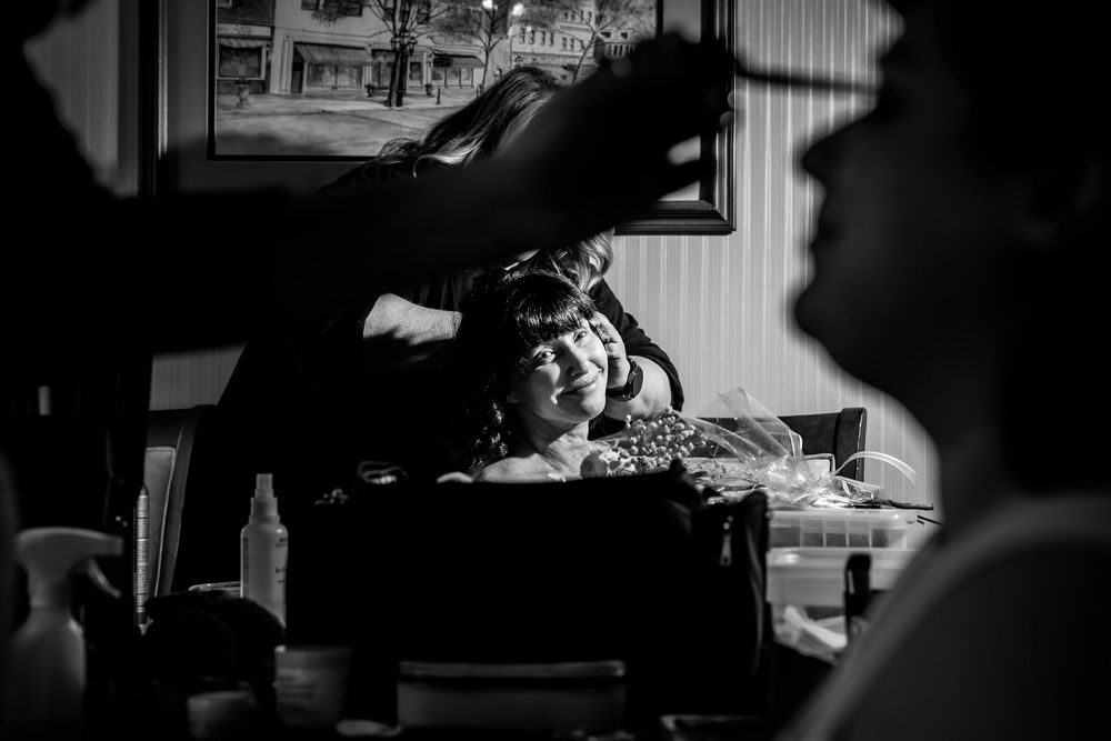 Dramatic black and white photos show intimate wedding reception moments.