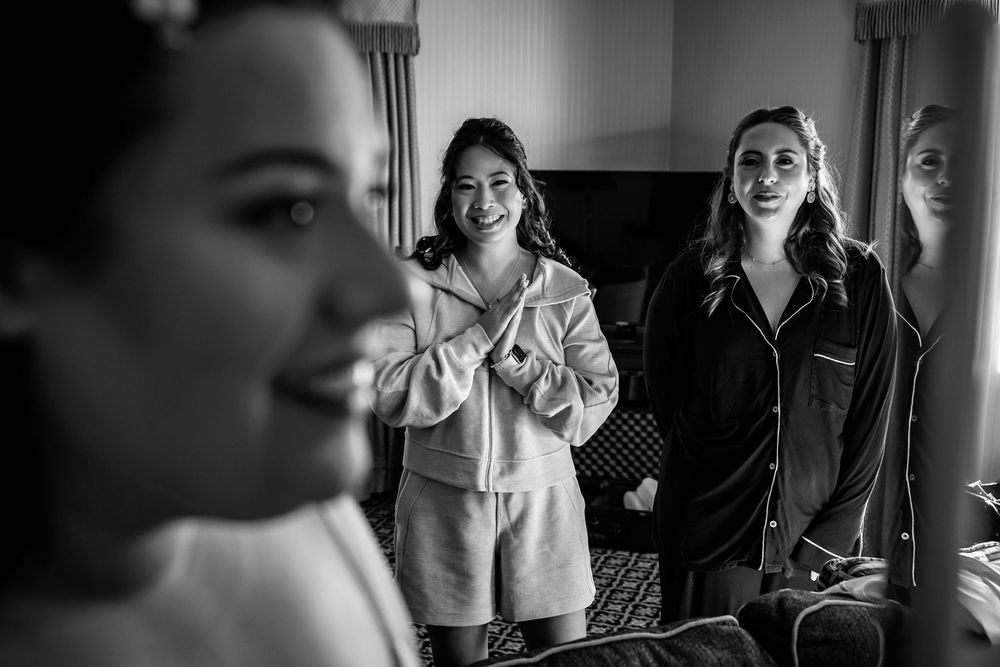 Black and white candid shots capture preparation moments before a wedding ceremony.