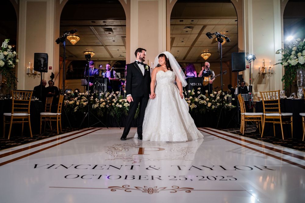 Elegant wedding reception venue with arched doorways and decorative lighting creating a romantic atmosphere.