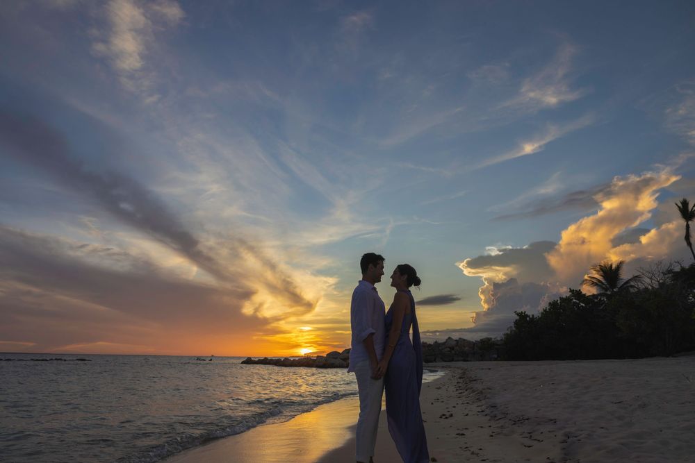 Scenic beach wedding photo series showing silhouettes against dramatic sunset skies and ocean views.