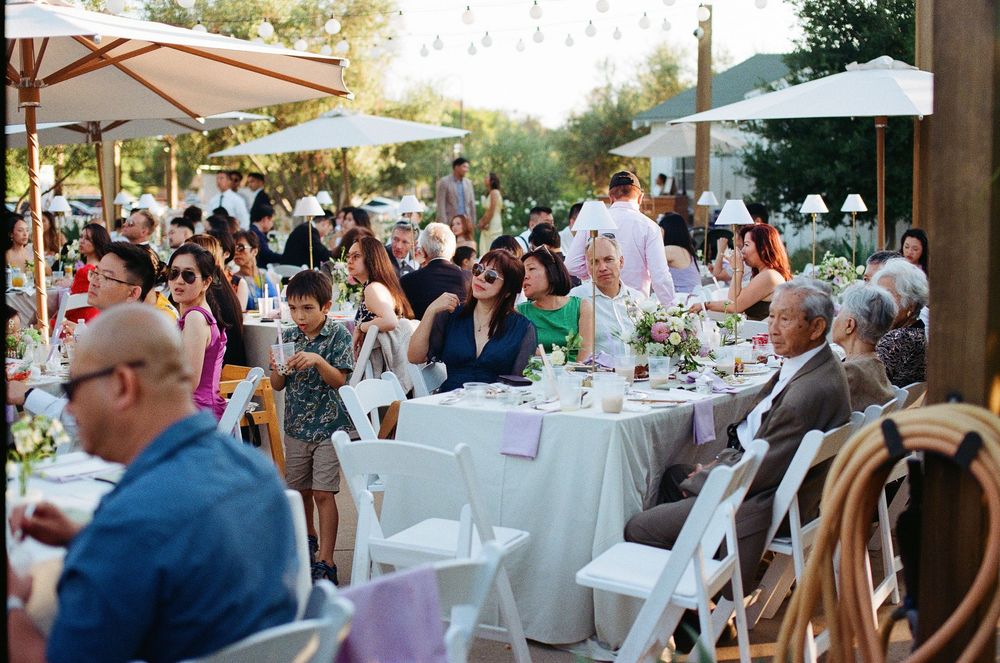 Candid Orange County wedding photographer film shot of the couple dancing with their guests at the lively Aliso Viejo reception.