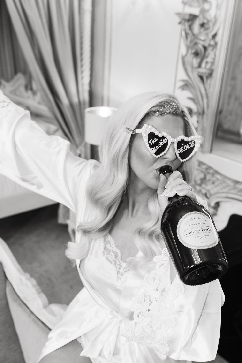A series of black and white images showing wedding dress details with heart-shaped sunglasses and bridal accessories.