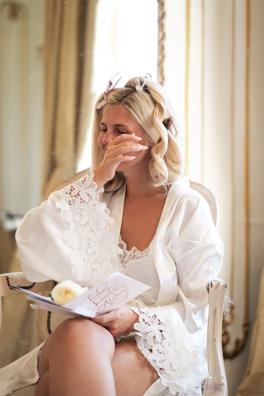 A series of intimate boudoir photos showing a person in white lace lounging in an elegant room.