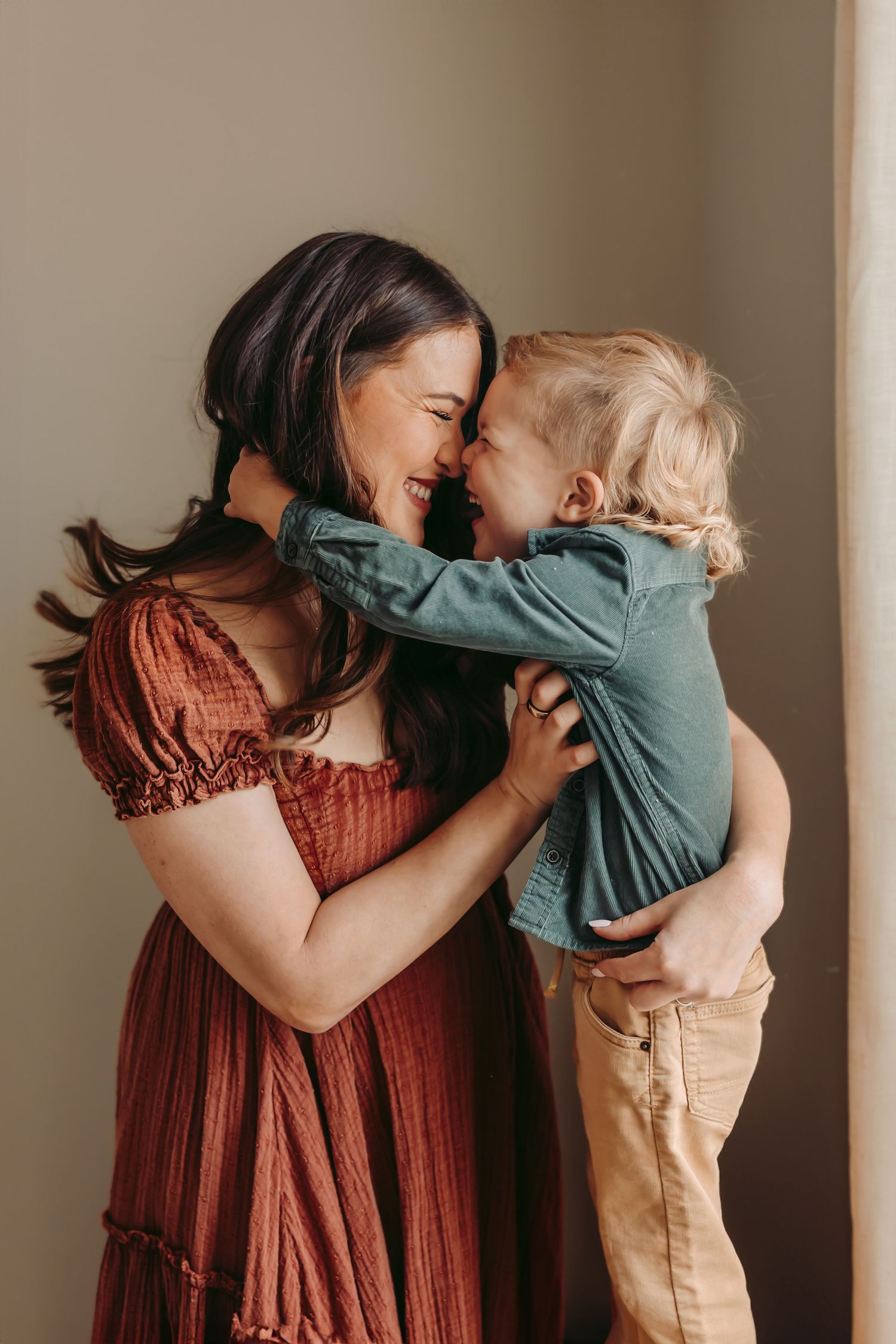 Mom and toddler boy giggling nose-to-nose during a Maryville, TN studio session