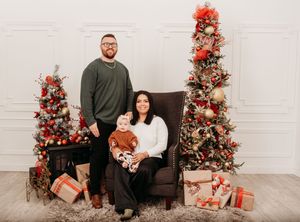 A series of holiday photos with a decorated Christmas tree, presents, and festive decor against a white brick backdrop.
