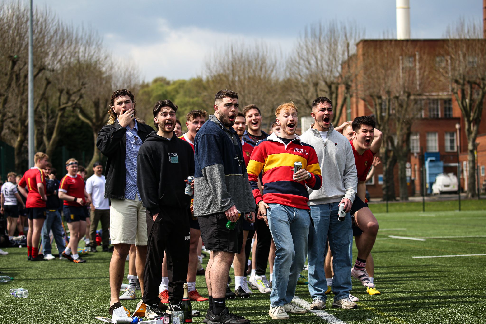 Candid photo of stunned faces following a rugby tackle at a rugby sevens tournament at the University of Birmingham
