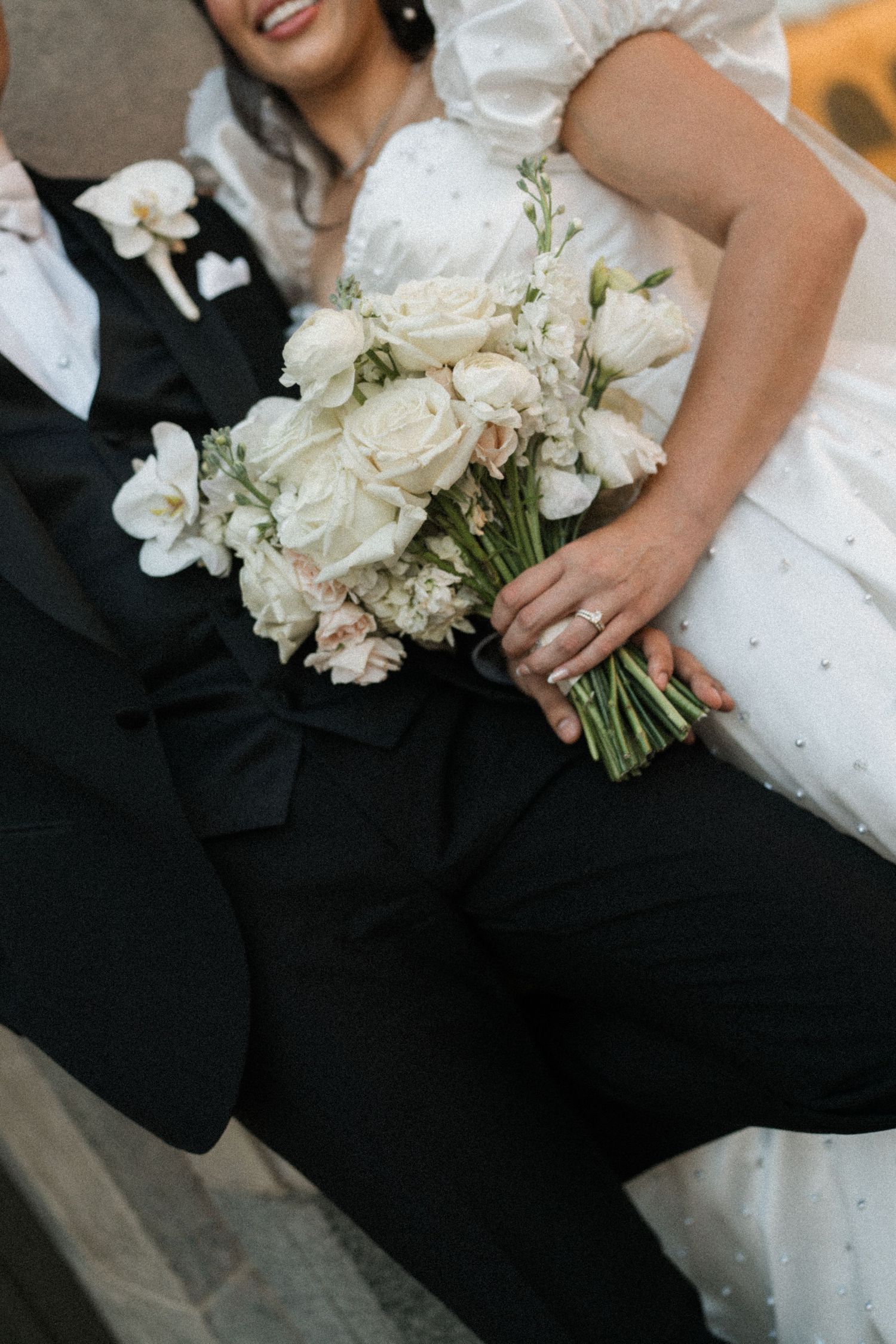 Wedding ceremony in traditional church with wooden pews and exposed beam ceiling.