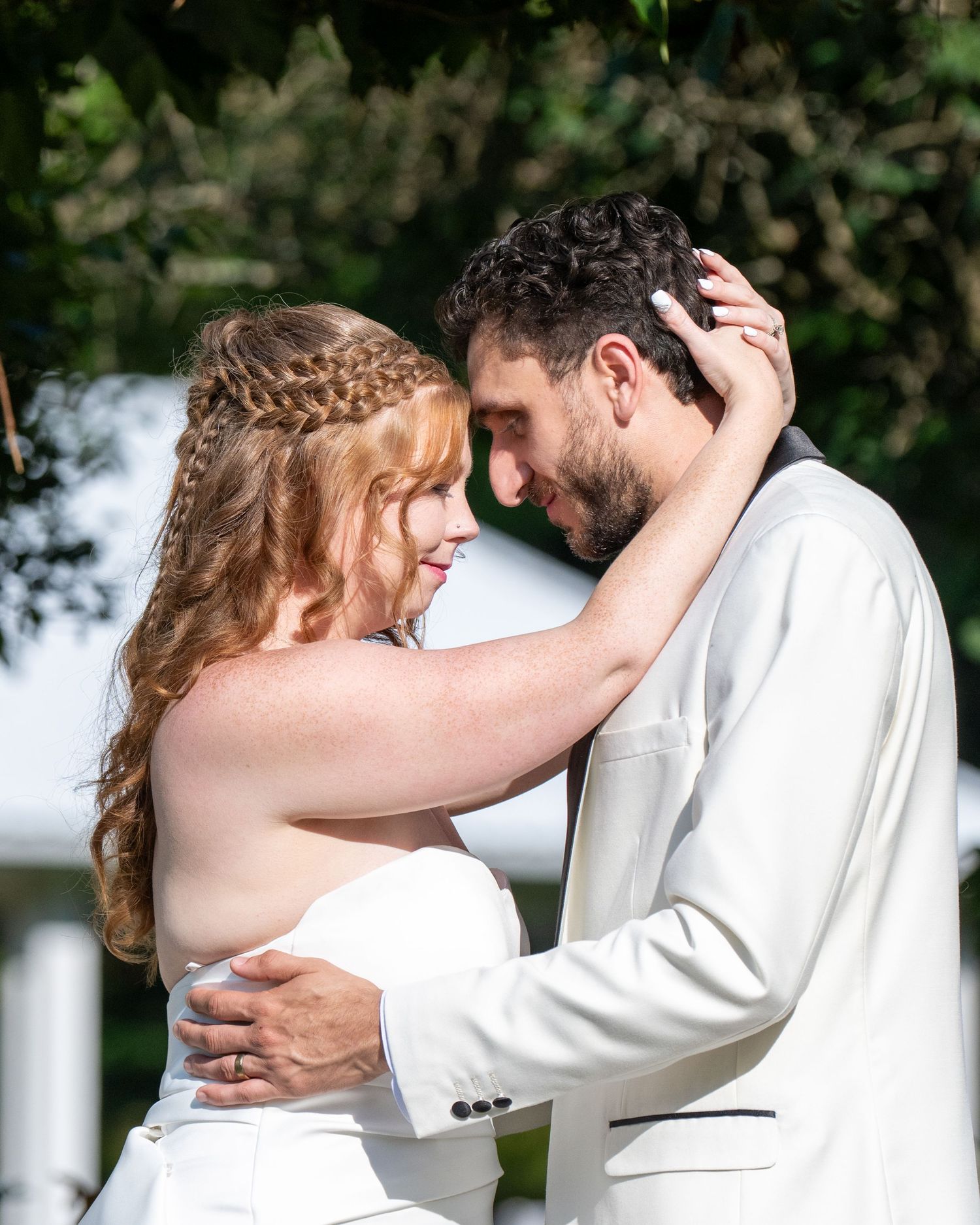 Couple shares an intimate moment, telling part of their love story through true-to-color photography.