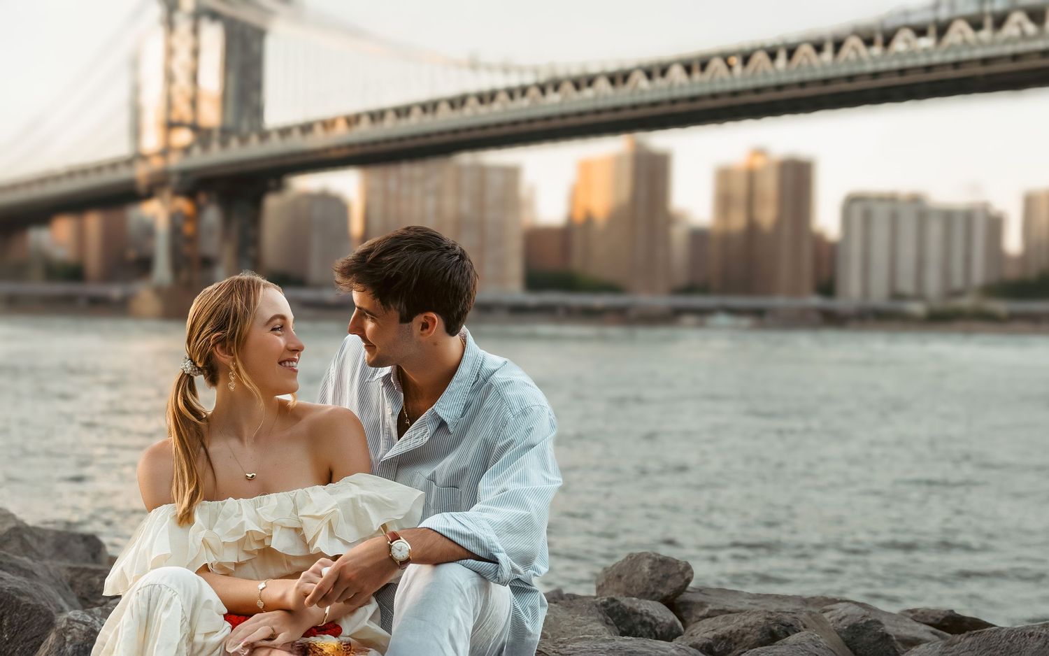 Waterfront couple photoshoot in Dubai with skyline backdrop