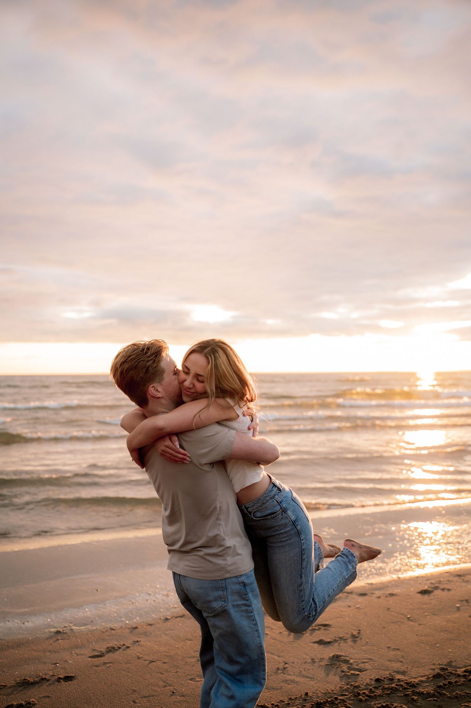 Intimate couple shares tender moment during golden hour outdoor portrait session.