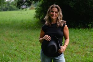 Candid outdoor photography session featuring relaxed poses in nature.