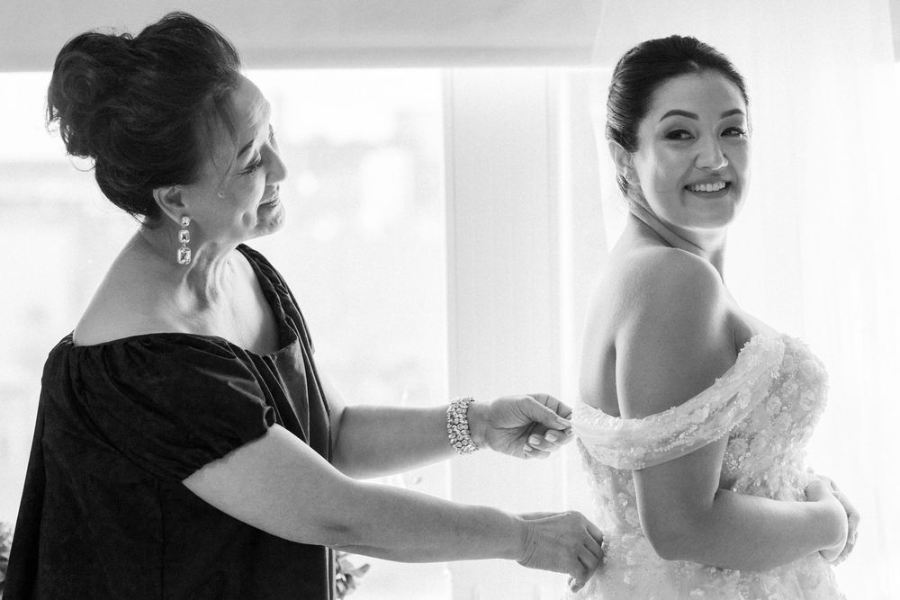 Black and white getting ready photo with elegant bridal preparations.