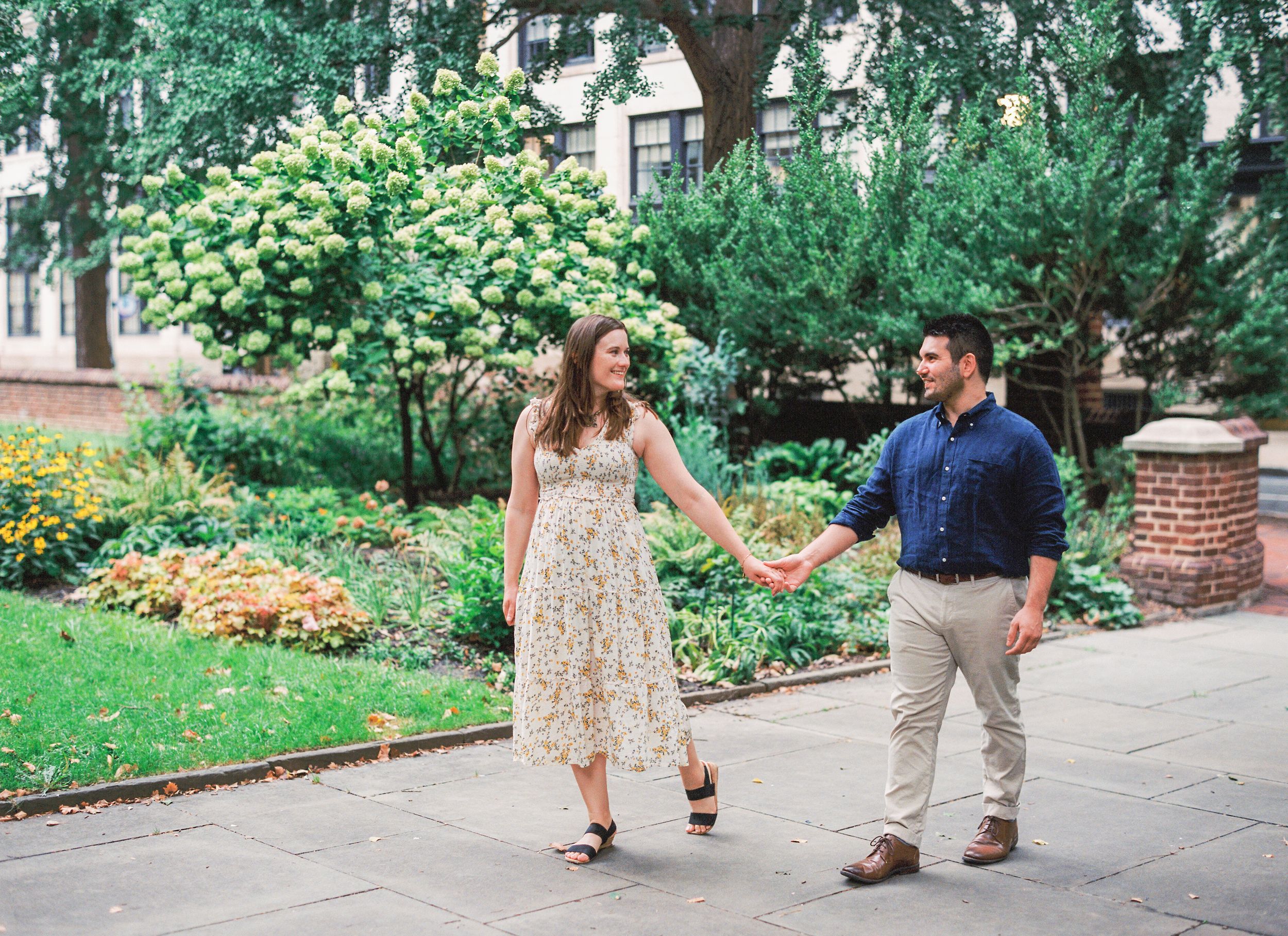 A sequence of engagement proposal photos in a garden setting showing a couple as one kneels down.