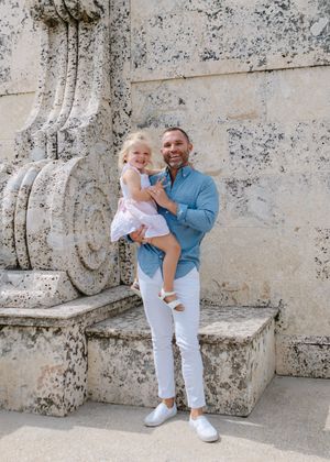 A playful family moment on historic stone steps.