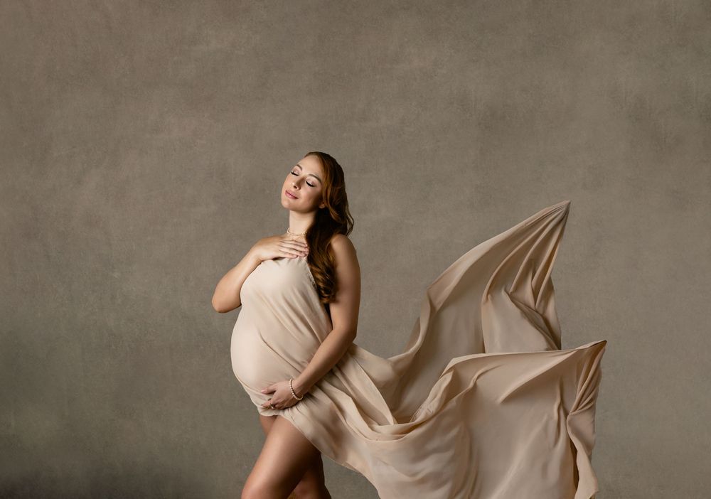 A flowing beige maternity gown, Orlando Maternity Photography, Sanford Maternity Photography