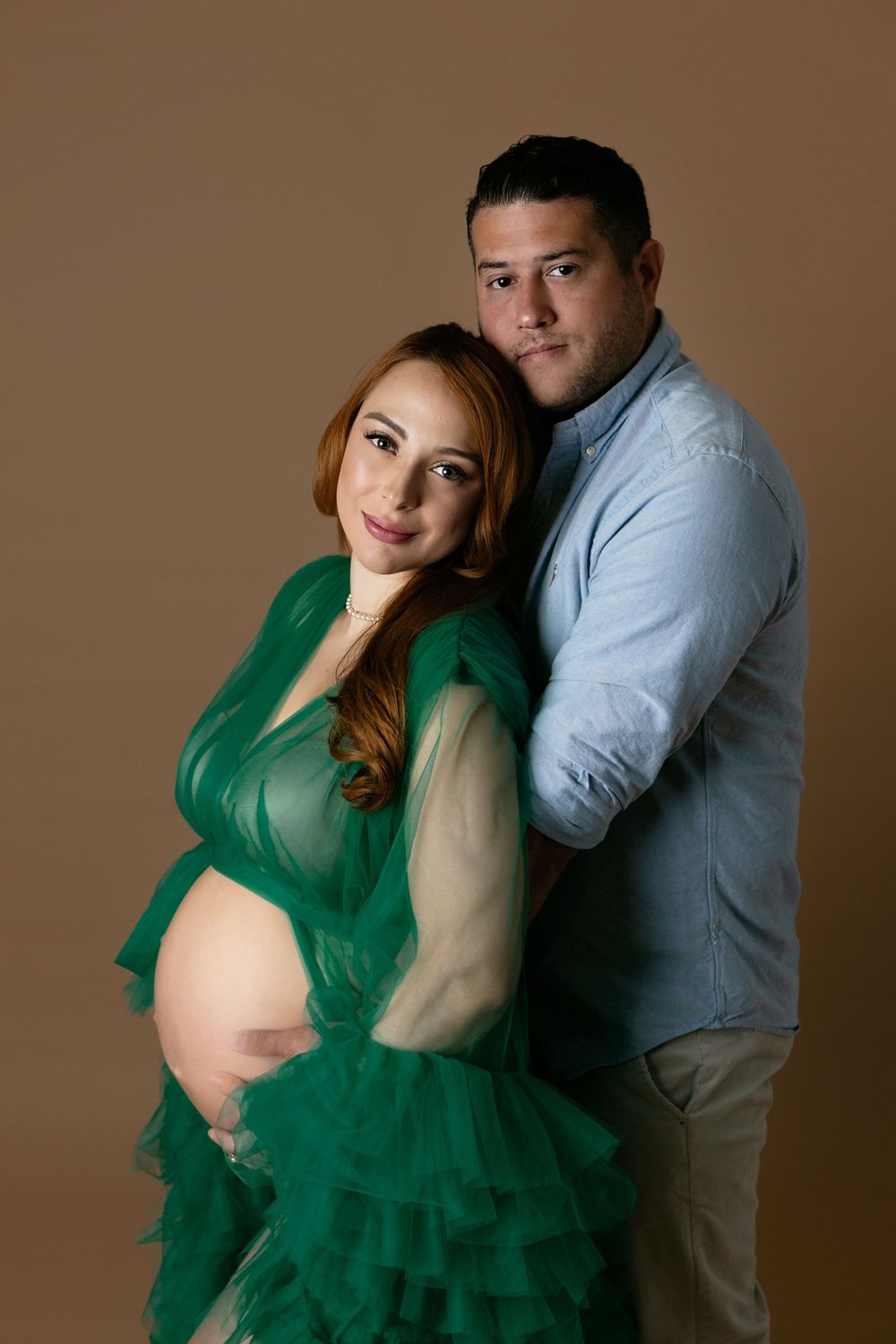 A tender maternity photo showing a couple embracing, Orlando Maternity Photography, Sanford Maternity Photography