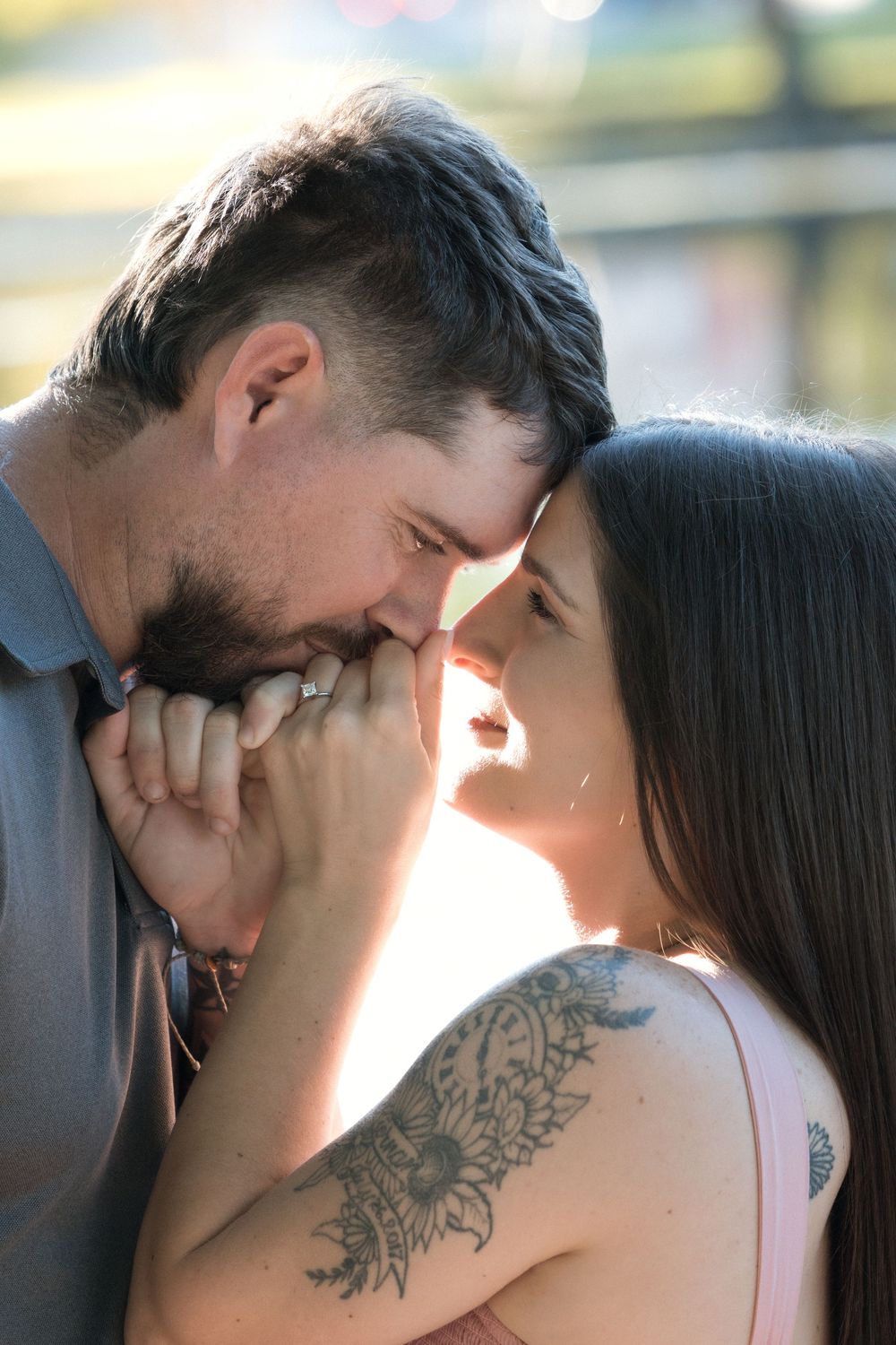 Romantic sequence captured in warm sunlight showing a tender moment between two people.
