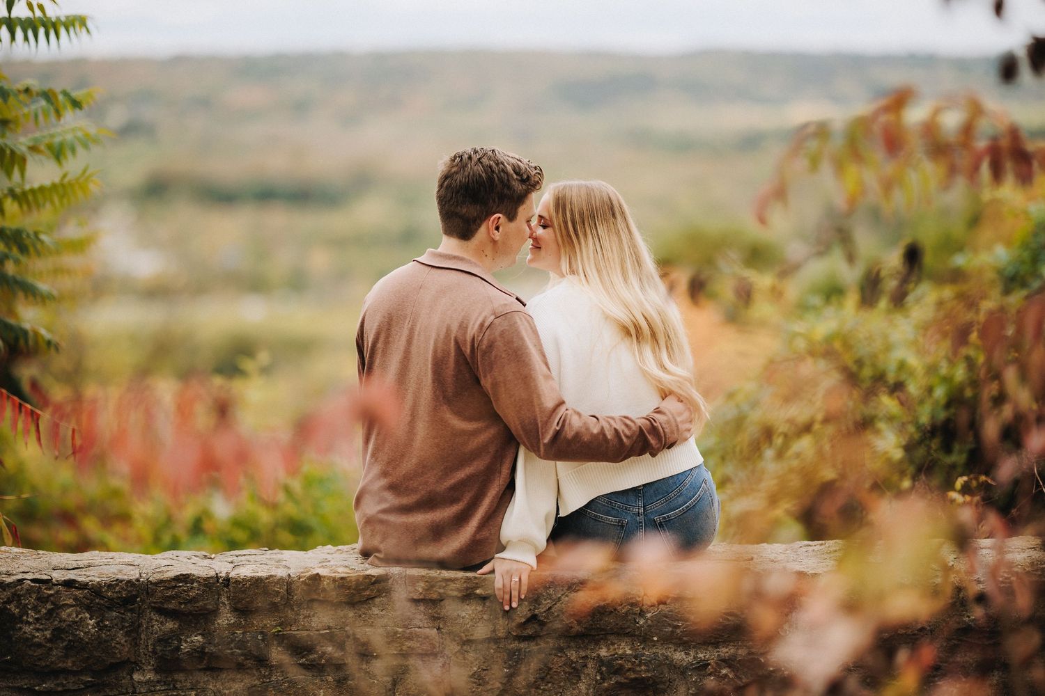 Engagement Candid Moment | Couple Embracing | Scenic valley during golden hour | Cincinnati Wedding Photography | Alt Park | Cincinnati, OH