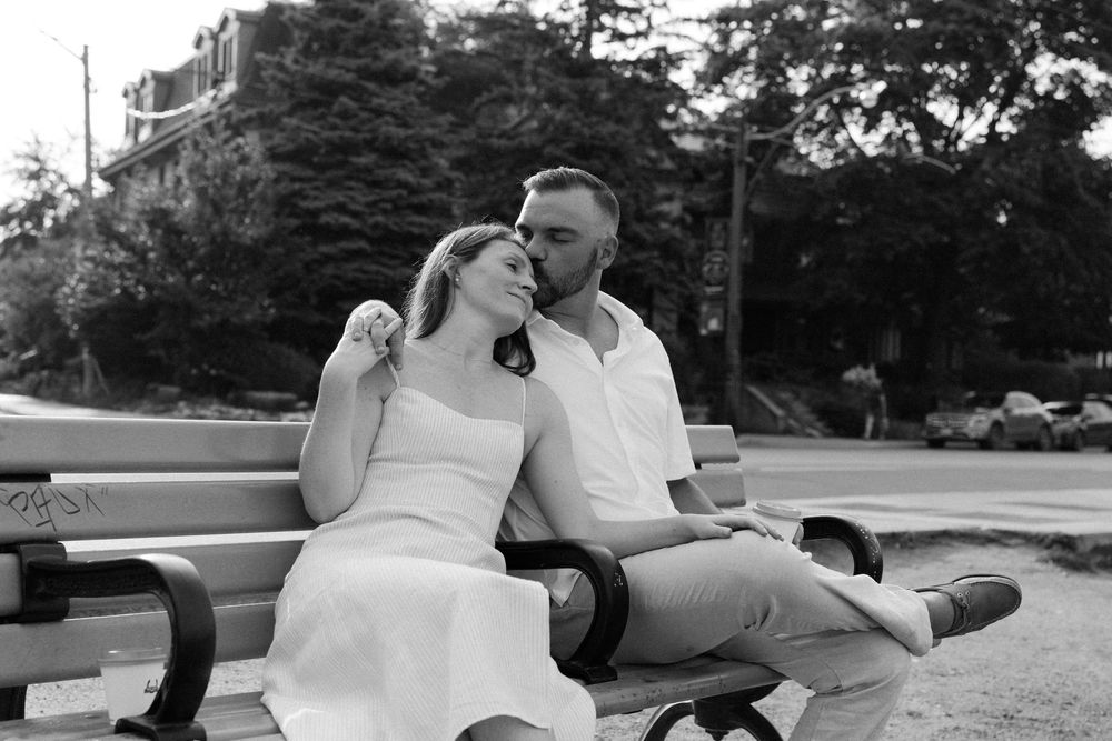 Black and white romantic sequence of couple lounging together outdoors.