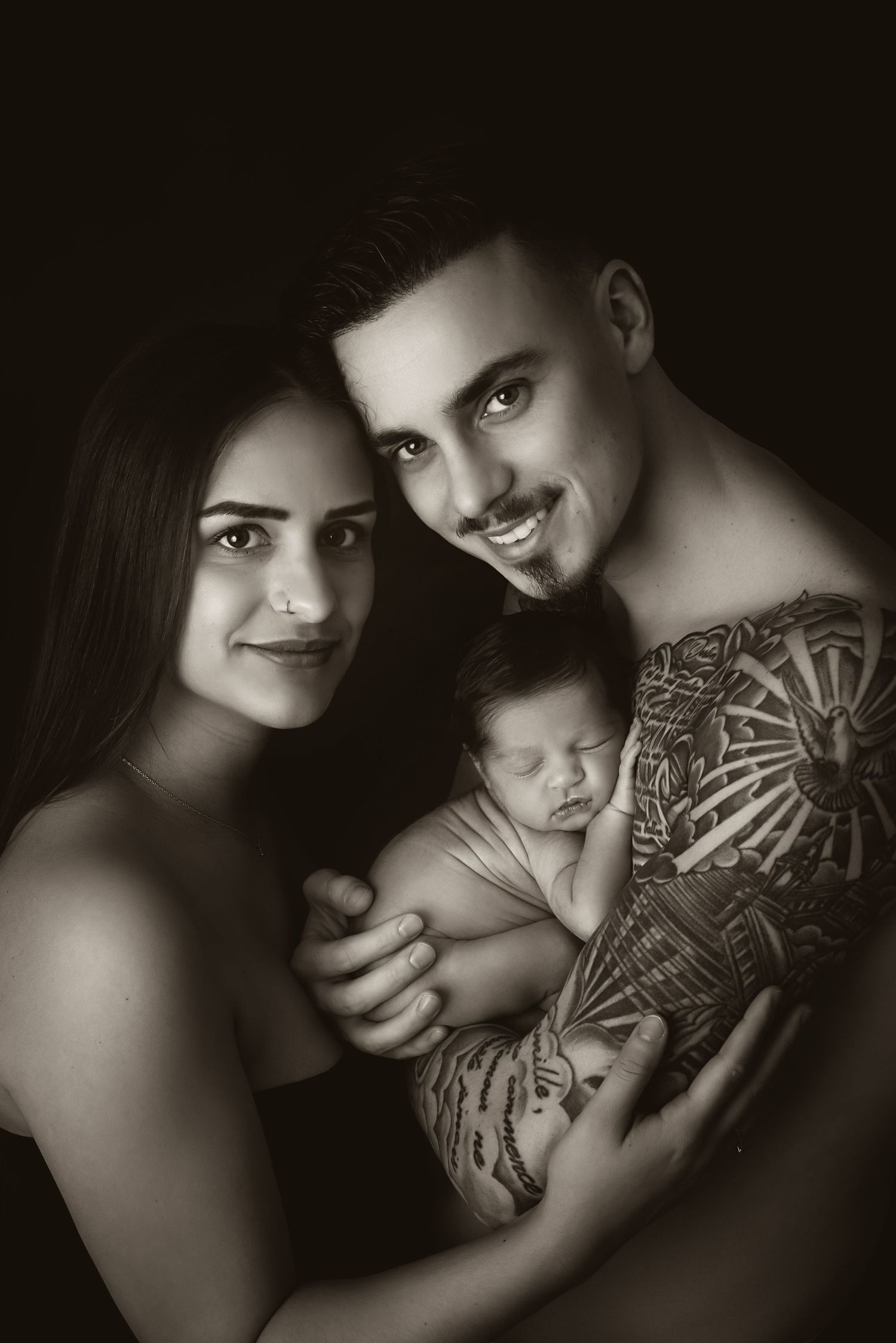 Artistic black and white portrait from a new family with their first newborn